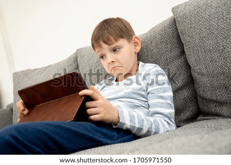 Similar – Little boy using a tablet