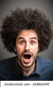 Astonished Cool Guy With Afro Hair