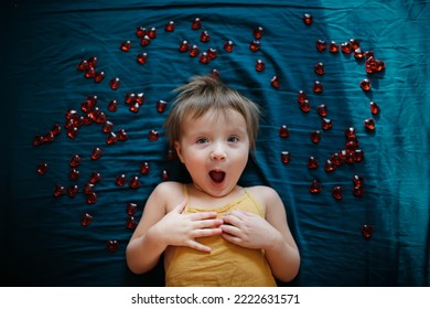 Astonished Emotional Child, Portrait Of Top View On Dark Background.