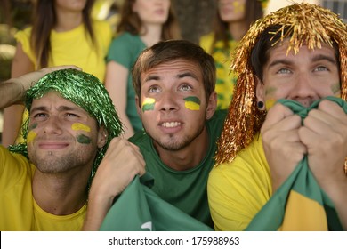 Astonished Group Of Brazilian Sport Soccer Fans Looking At The Screen.