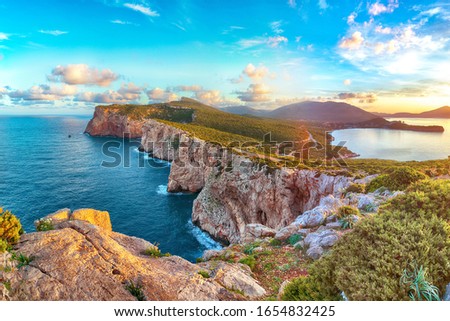 Astonishing morning view on Cacccia cape. Panoramic view on the cliffs at sunrise. Fantastic Mediterranean seascape. Location:  Alghero, Province of Sassari, Italy, Europe