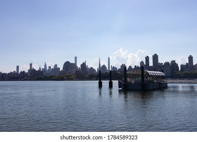Astoria Queens Ferry Boat Stop with the Roosevelt Island and Manhattan Skyline view in New York City - Shutterstock ID 1784589323