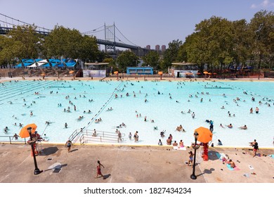 Astoria Queens, New York / USA - August 25 2020: Astoria Pool At Astoria Park During The Summer With People And The Triborough Bridge In The Background