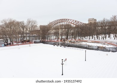 Astoria Queens, New York USA - December 19 2020: Astoria Pool At Astoria Park Covered With Snow During Winter In Astoria Queens New York With The Hell Gate Bridge