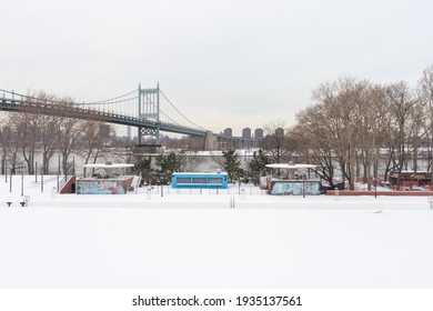 Astoria Queens, New York USA - December 19 2020: Astoria Pool At Astoria Park Covered With Snow During Winter In Astoria Queens New York With The Triborough Bridge