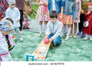 Astrakhan, Russia - 05.08.2016: Egg Rolling, Or An Easter Egg Roll Is A Traditional Game Played With Eggs At Easter