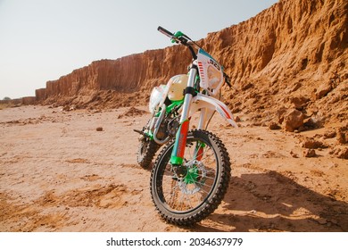 Astrakhan Russia 08 18 2021Pit Bike In The Desert. Extreme Sports Concept.