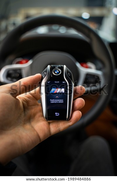 Astrakhan, Russia 12 June 2021: modern\
touch-sensitive BMW sports car key in your\
hand