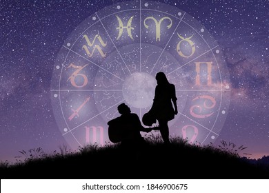 Astrological zodiac signs inside of horoscope circle. Couple singing and dancing over the zodiac wheel and milky way background. The power of the universe concept. - Shutterstock ID 1846900675