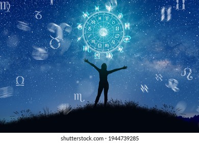 Astrological zodiac signs inside of horoscope circle. Illustration of Woman silhouette consulting the stars and moon over the zodiac wheel and milky way background. The power of the universe concept. - Shutterstock ID 1944739285
