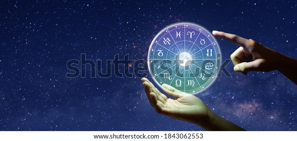 Astrological zodiac signs inside of\
horoscope circle. Astrology, knowledge of stars in the sky over the\
milky way and moon. The power of the universe\
concept.