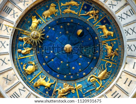 Astrological Zodiac signs on Ancient clock Torre dell'Orologio in St Mark's Square, Venice, Italy, Europe. Detail with clock face and constellations. Medieval science, horoscope and Astrology concept