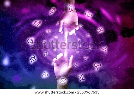Astrology. People joining fingers, zodiac signs around hands against starry night sky, closeup