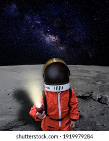 An Astronaut Child Looking Up To The Sky On The Surface Of The Moon With Outer Space On The Background. Elements Of This Image Furnished By NASA.