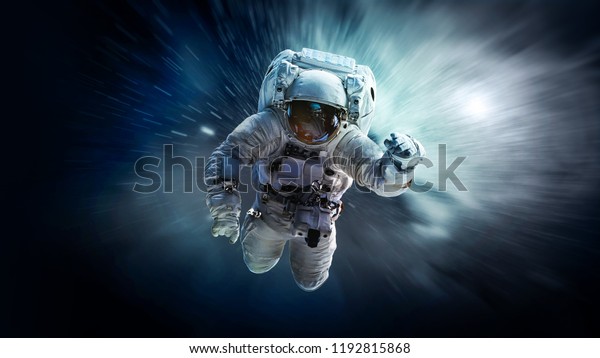 Astronaut in deep space floating in weightlessness.\
Galaxy on the background. Space art wallpaper. Elements of this\
image furnished by\
NASA