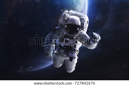 Astronaut. Deep space image, science fiction fantasy in high resolution ideal for wallpaper and print. Elements of this image furnished by NASA