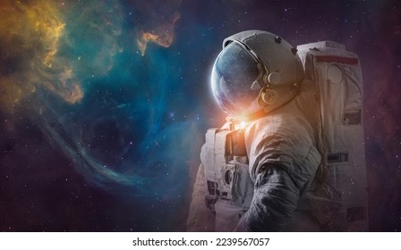 Astronaut in deep space. Science space art. Creative surreal wallpaper. Spaceman in bright galaxy. Elements of this image furnished by NASA