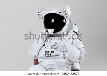 Astronaut drinking espresso, white background