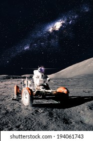 Astronaut Drives Rover. Elements Of This Image Furnished By NASA