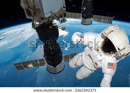 astronaut float in the space in weightlessness working on the spaceship near to planet earth Elements of this image furnished by NASA
