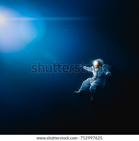 Astronaut floating in outer space / high contrast image