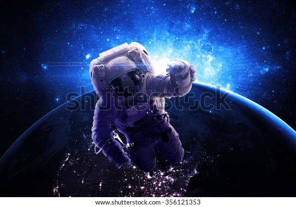 Astronaut Floating Through Space - Elements of this\
Image Furnished by\
NASA