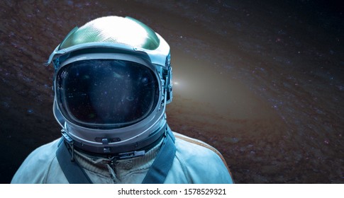 Astronaut in a front of stars in outer space. Conquest of Space Concept, Elements of this image were furnished by NASA - Powered by Shutterstock