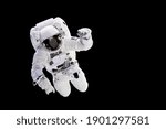 Astronaut with a jetpack isolated on black background with copy space -  Elements of this image are furnished by NASA