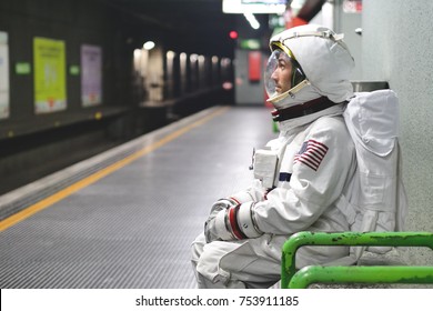 An astronaut just landed from space, on the new planet, explore the new world and live there. Concept of: success road, dreams, astronaut, inspiration.