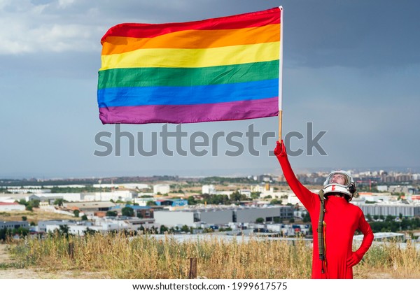 astronaut holding the gay pride