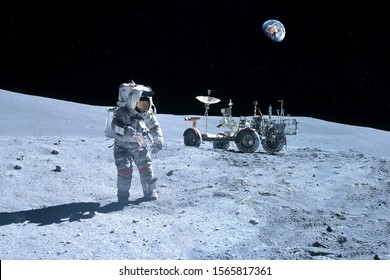 Astronaut Near The Moon Rover On The Moon. With Land On The Horizon. Elements Of This Image Were Furnished By NASA.