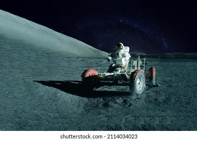 Astronaut Near The Moon Rover On The Moon. With Land On The Horizon. Elements Of This Image Were Furnished By NASA. High Quality Photo