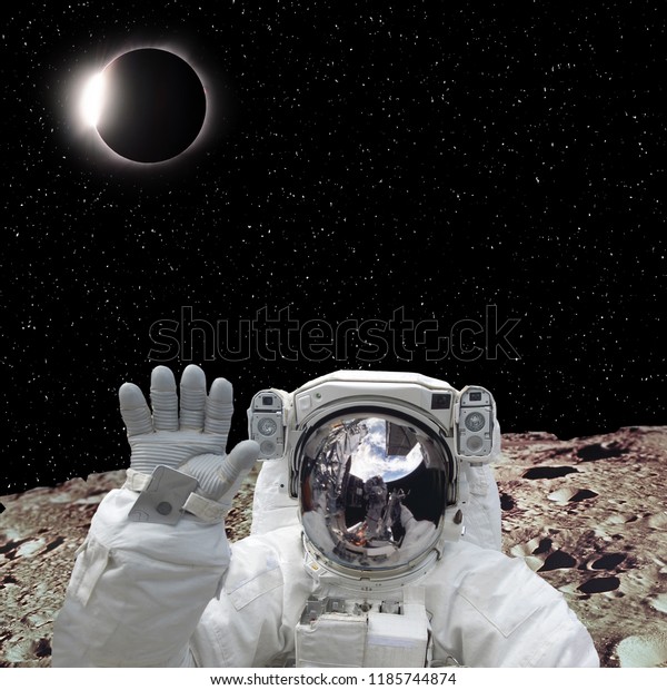 Astronaut on the
extrasolar planet and solar eclipse on behind. The elements of this
image furnished by
NASA.
