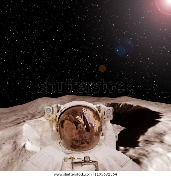 Astronaut on the extrasolar planet. Strange stony\
landscape on the background. The elements of this image furnished\
by NASA.\
