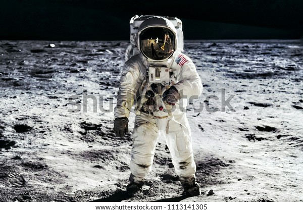 Astronaut on lunar moon landing mission Apollo 11.\
Astronaut space walk on moon surface in spacesuit. Space,science\
fiction,galaxy & universe wallpaper. Elements of this image\
furnished by NASA