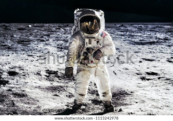 Astronaut on lunar moon landing mission Apollo
11.Astronaut space walk on moon surface in spacesuit.Space,science
fiction,galaxy & universe wallpaper. Elements of this image
furnished by NASA