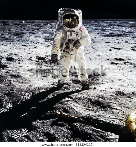 Astronaut on lunar moon landing mission Apollo\
11.Astronaut space walk on moon surface in spacesuit. Space,science\
fiction,galaxy & universe wallpaper. Elements of this image\
furnished by NASA
