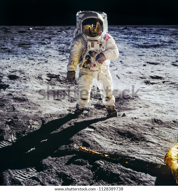 Astronaut on lunar moon landing mission Apollo\
11.Astronaut space walk on moon surface in spacesuit. Elements of\
this image furnished by\
NASA