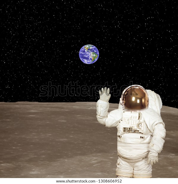 Astronaut on the moon.\
Blue fascinating earth on the background. Elements of this image\
furnished by NASA.\
