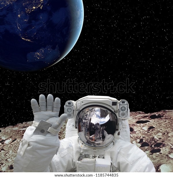 Astronaut on the moon and\
earth planet on the background. The elements of this image\
furnished by NASA.\
