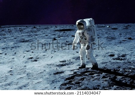 Astronaut on the moon, with galactic background. Elements of this image were furnished by NASA. High quality photo