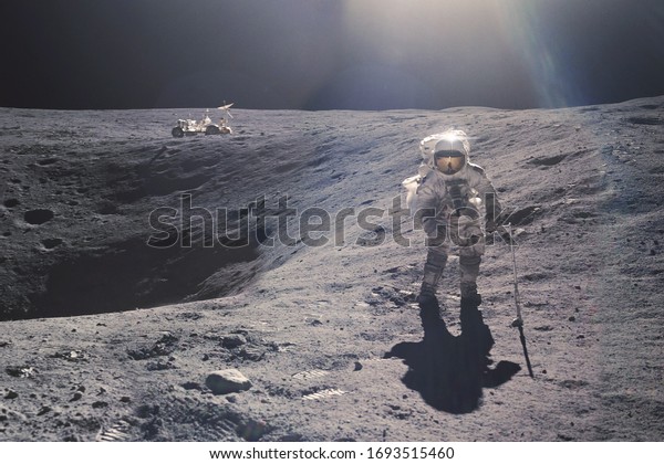 Astronaut on rock surface with space\
background. Elements of this image furnished by\
NASA