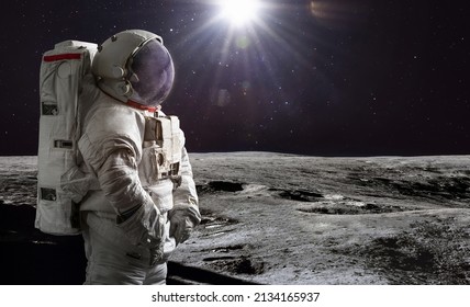 Astronaut On Surface Of Moon. Artemis Lunar Space Program. Moonwalk Of Spaceman. Elements Of This Image Furnished By NASA