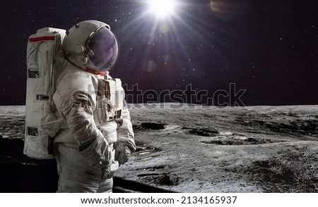 Astronaut on surface of Moon. Artemis lunar space program. Moonwalk of spaceman. Elements of this image furnished by NASA