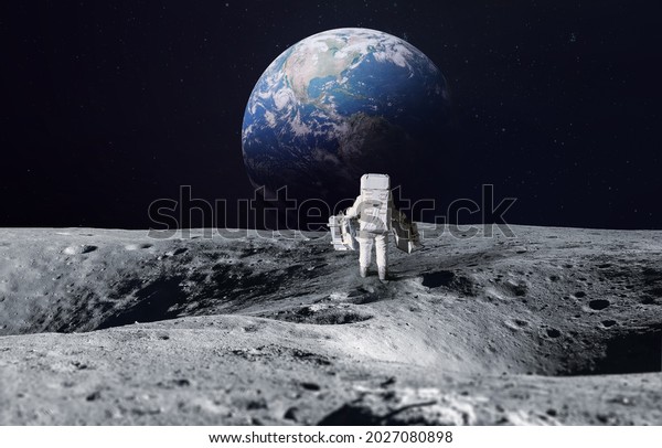 Astronaut on surface of Moon. Planet Earth on the\
background. Apollo space program. Artemis program. Elements of this\
image furnished by\
NASA.