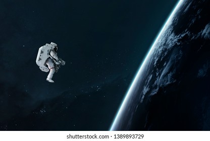 Astronaut orbiting Earth planet, EVA, science fiction image. Elements of this image furnished by NASA - Powered by Shutterstock