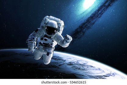 Astronaut in outer space. Elements of this image furnished by NASA