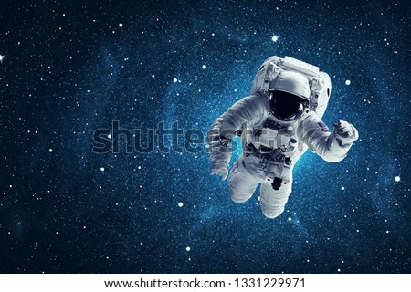 Astronaut in outer space. Elements of this image furnished by NASA
