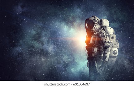 Astronaut in outer space. Mixed media - Shutterstock ID 631804637