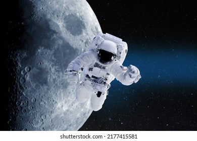 Astronaut in outer space on a background of moon. National Moon Day. Conceptual image. Elements of this image furnished by NASA.